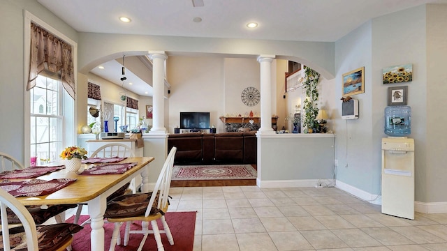 16 Ocean Greens Dr, Saco, ME 04072 - dining space with baseboards, arched walkways, light tile patterned floors, and ornate columns