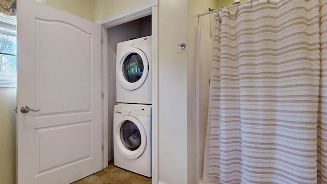 16 Ocean Greens Dr, Saco, ME 04072 - clothes washing area featuring stacked washer / dryer and laundry area