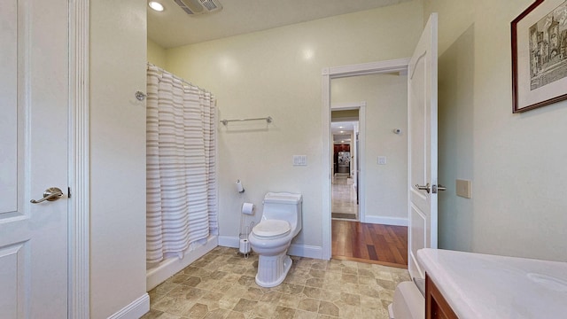 16 Ocean Greens Dr, Saco, ME 04072 - bathroom with baseboards, visible vents, toilet, and curtained shower