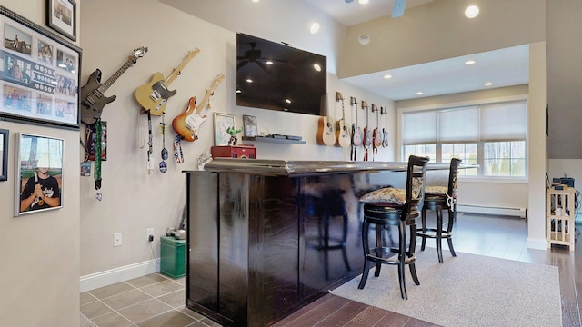 16 Ocean Greens Dr, Saco, ME 04072 - bar with a baseboard heating unit, recessed lighting, baseboards, a dry bar, and wood finished floors