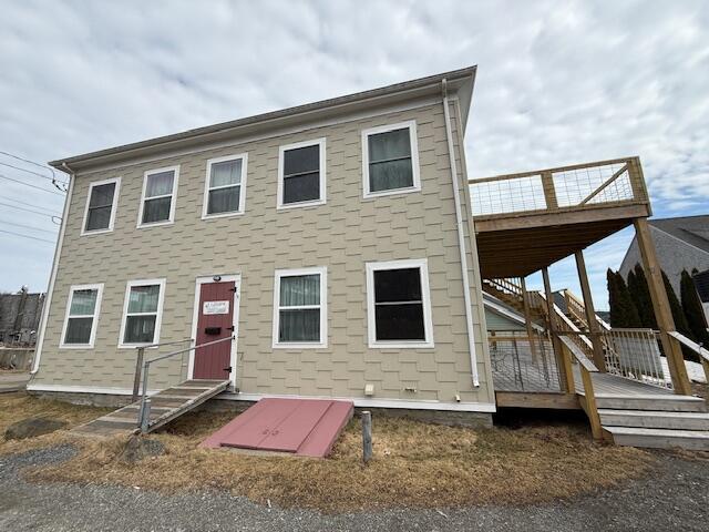 6 School St, Lubec, ME 04652 - colonial-style house featuring stairway, a deck, and entry steps