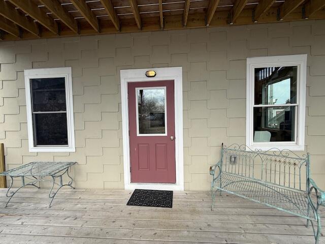 6 School St, Lubec, ME 04652 - doorway to property with concrete block siding