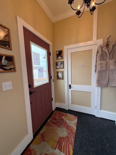 6 School St, Lubec, ME 04652 - doorway to outside featuring baseboards, a notable chandelier, and crown molding
