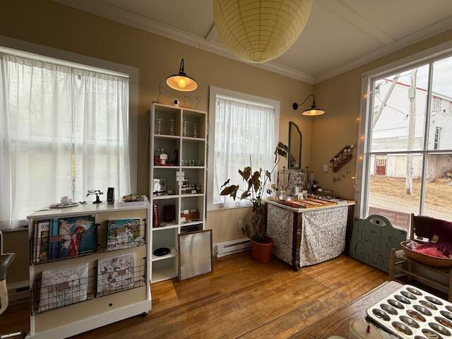 6 School St, Lubec, ME 04652 - misc room featuring wood finished floors, a baseboard heating unit, and ornamental molding
