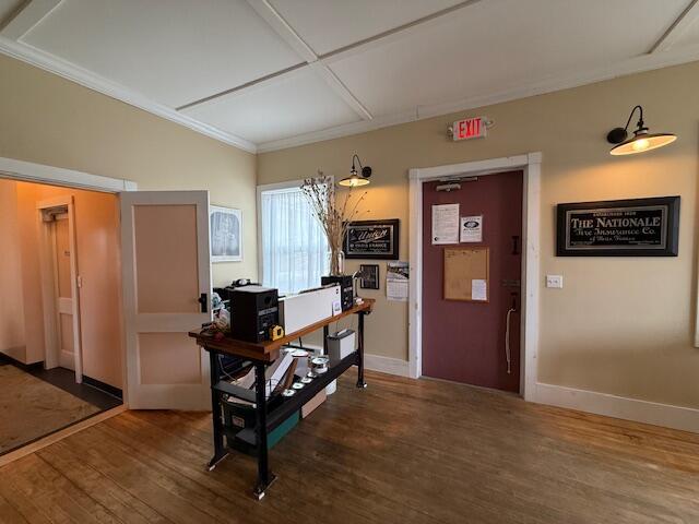 6 School St, Lubec, ME 04652 - foyer entrance with baseboards, wood finished floors, and crown molding
