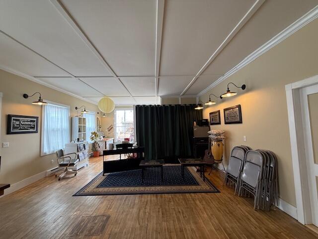 6 School St, Lubec, ME 04652 - living room with wood finished floors, baseboards, and ornamental molding