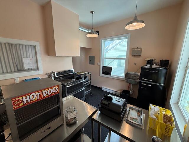6 School St, Lubec, ME 04652 - kitchen with electric panel, double oven range, and pendant lighting