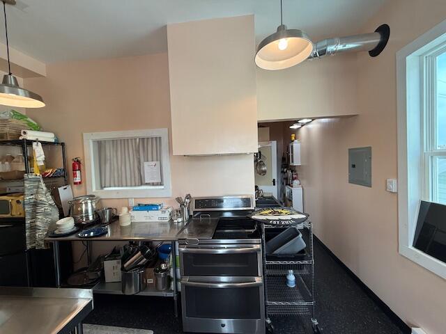 6 School St, Lubec, ME 04652 - kitchen with electric panel, pendant lighting, and range with two ovens