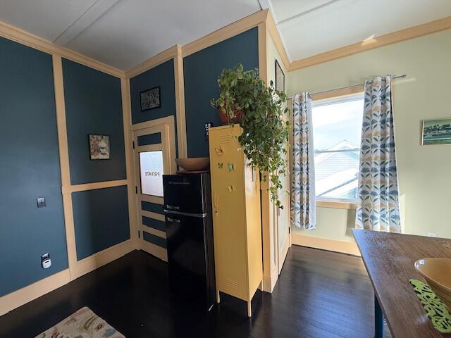 6 School St, Lubec, ME 04652 - kitchen featuring dark wood-style floors and ornamental molding