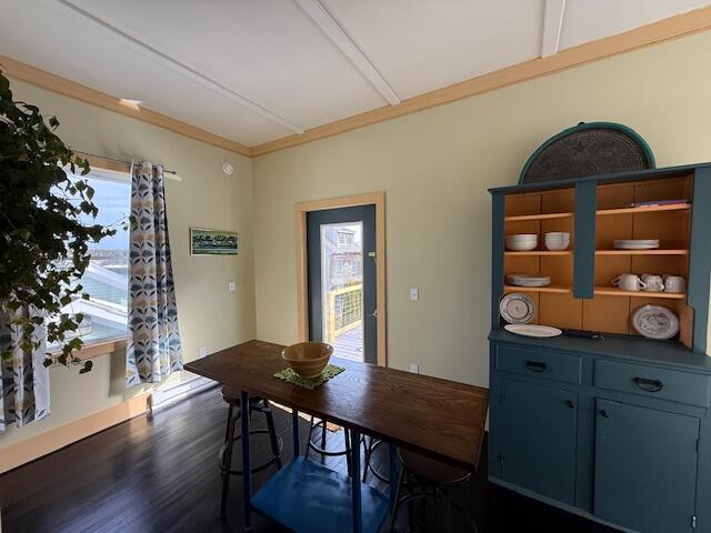 6 School St, Lubec, ME 04652 - dining room featuring crown molding and dark wood-style flooring