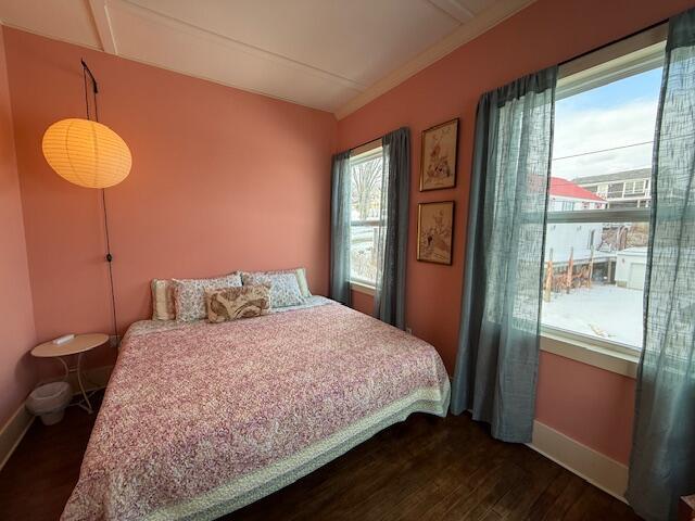 6 School St, Lubec, ME 04652 - bedroom with baseboards and dark wood-style flooring