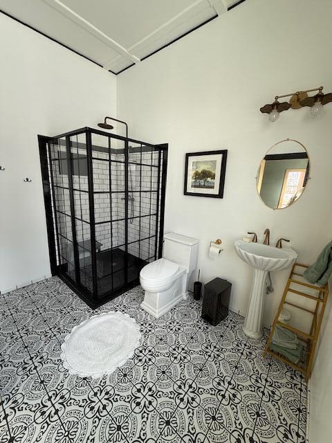 6 School St, Lubec, ME 04652 - bathroom with tile patterned floors, toilet, and a sink