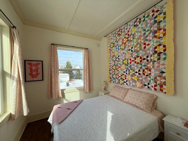 6 School St, Lubec, ME 04652 - bedroom featuring crown molding, wood finished floors, and baseboards