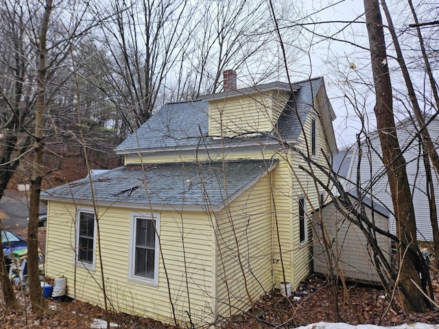 68 Boothby St, Augusta, ME 04330 - view of home's exterior featuring a chimney and a shingled roof