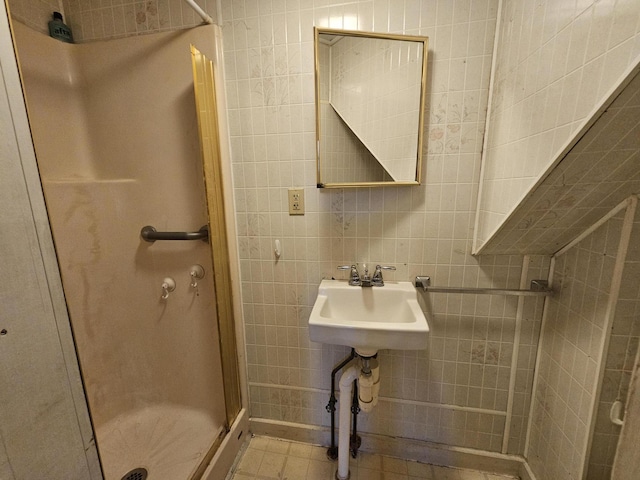 68 Boothby St, Augusta, ME 04330 - full bathroom with tile walls, decorative backsplash, a stall shower, and tile patterned flooring
