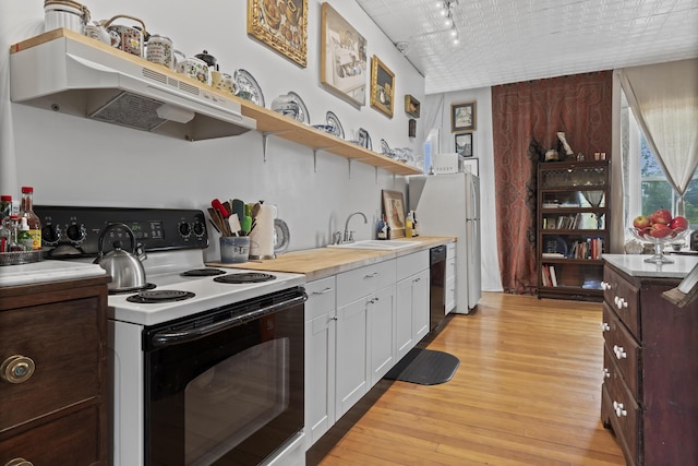 696 Bangor Rd, Troy, ME 04987 - kitchen featuring electric range oven, black dishwasher, light wood-style flooring, white cabinetry, and a sink