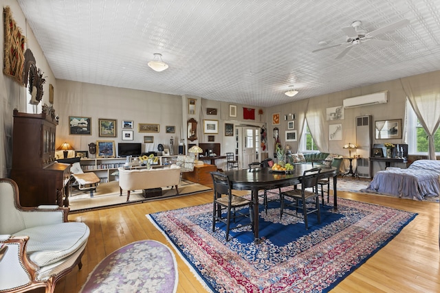 696 Bangor Rd, Troy, ME 04987 - dining room with hardwood / wood-style flooring, a ceiling fan, and a wall mounted AC