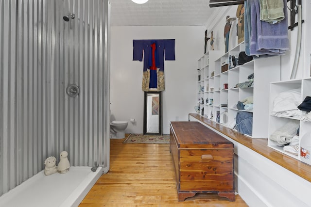 696 Bangor Rd, Troy, ME 04987 - interior space with hardwood / wood-style flooring, toilet, and a shower