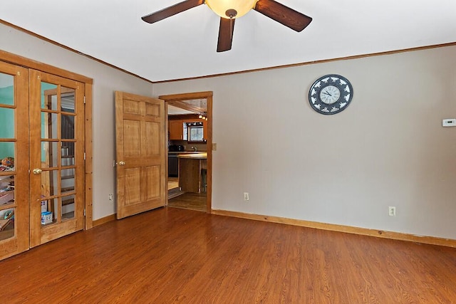 16 Libby Hill Rd, Gardiner, ME 04345 - spare room featuring french doors, dark wood-style flooring, baseboards, and crown molding