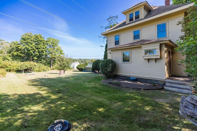 493 Main St, Eliot, ME 03903 - rear view of property featuring a yard and a chimney