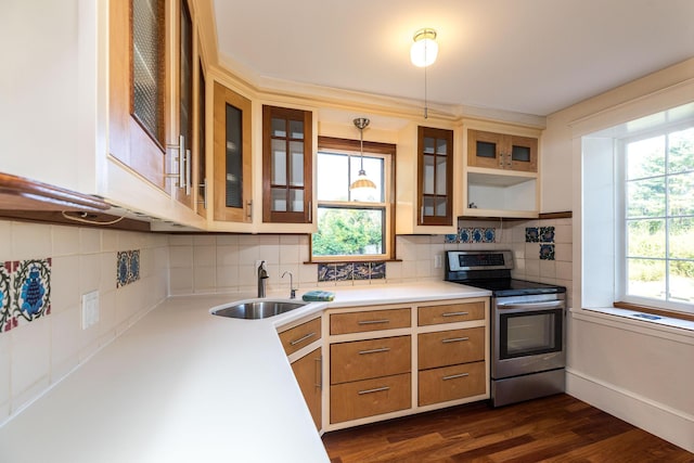 493 Main St, Eliot, ME 03903 - kitchen with stainless steel range with electric stovetop, a sink, light countertops, and decorative backsplash