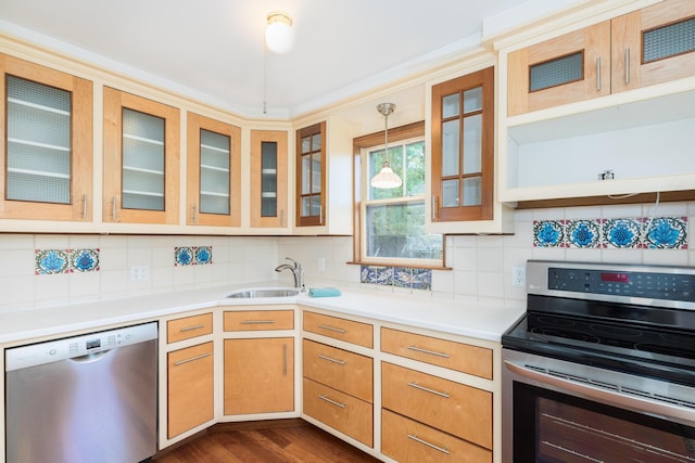 493 Main St, Eliot, ME 03903 - kitchen with appliances with stainless steel finishes, a sink, light countertops, backsplash, and dark wood finished floors