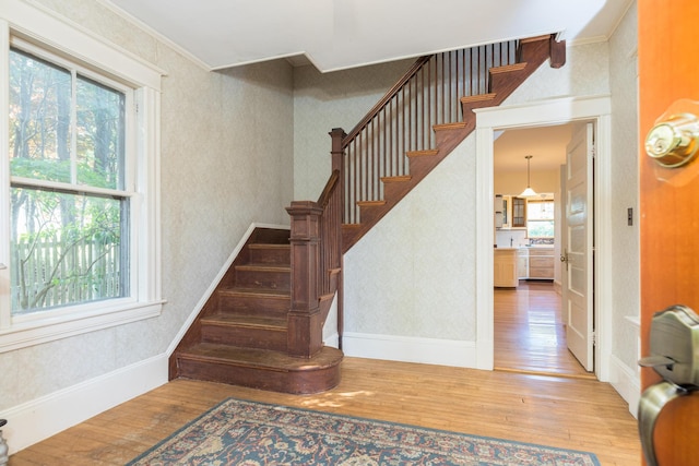 493 Main St, Eliot, ME 03903 - staircase featuring hardwood / wood-style floors, baseboards, and ornamental molding