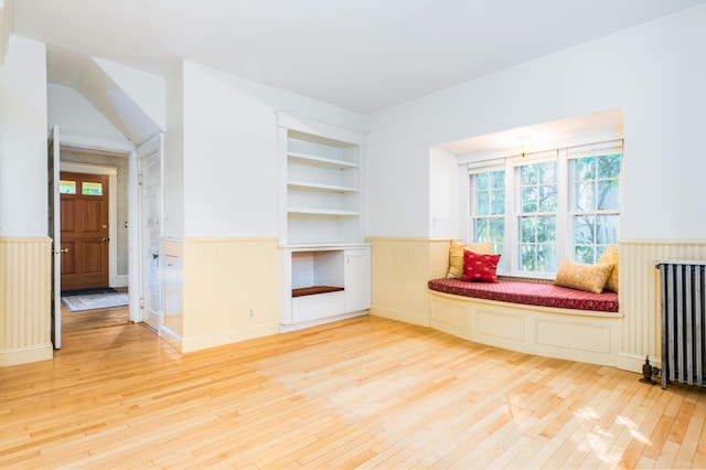 493 Main St, Eliot, ME 03903 - sitting room featuring wainscoting, hardwood / wood-style floors, and radiator heating unit