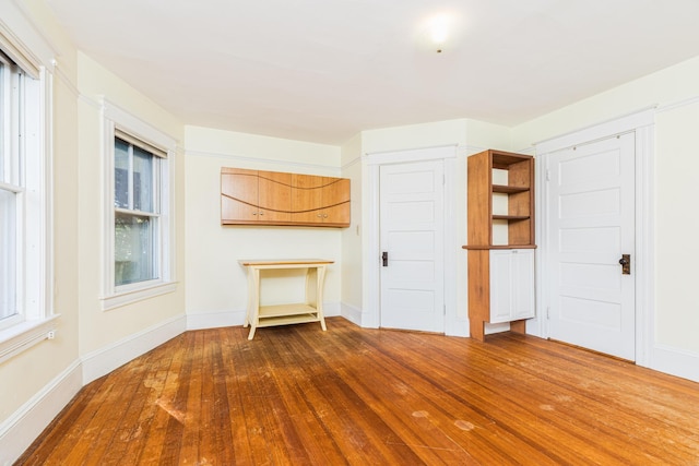 493 Main St, Eliot, ME 03903 - unfurnished bedroom with dark wood-style flooring and baseboards