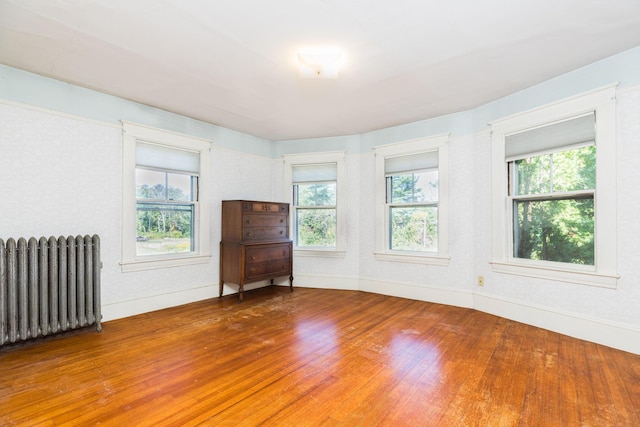 493 Main St, Eliot, ME 03903 - spare room featuring radiator, wood finished floors, healthy amount of natural light, and baseboards