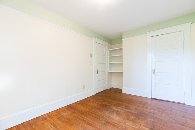 493 Main St, Eliot, ME 03903 - unfurnished bedroom featuring wood finished floors and baseboards
