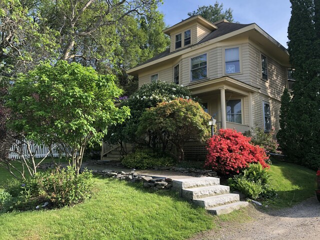 493 Main St, Eliot, ME 03903 - american foursquare style home with a porch, a front lawn, and stairway
