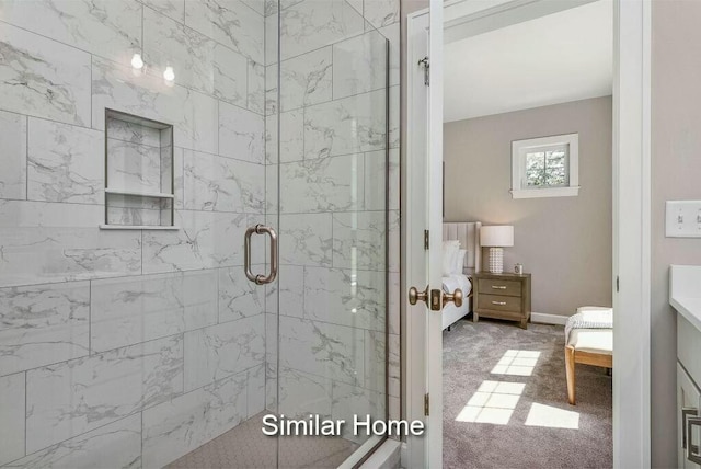 full bathroom featuring a shower stall, ensuite bath, and baseboards