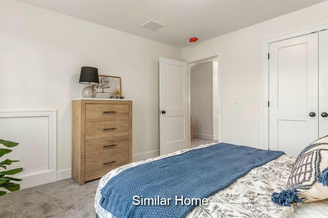 bedroom with visible vents, baseboards, and carpet floors