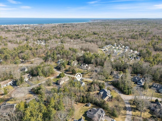birds eye view of property with a wooded view