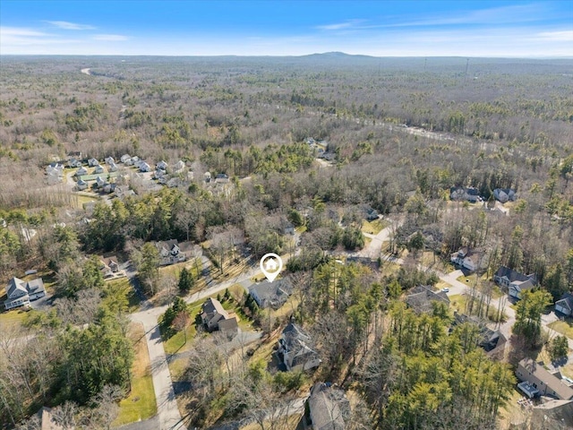 aerial view with a wooded view