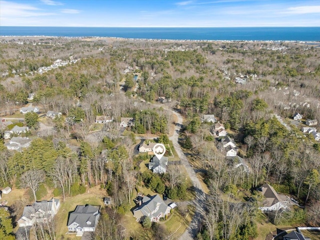 drone / aerial view featuring a view of trees and a residential view