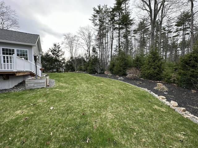 view of yard featuring a wooden deck