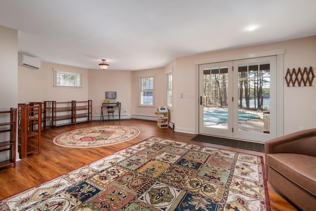 8 Spruce Point Rd, Kittery, ME 03904 - doorway to outside with a wall unit AC, baseboards, and wood finished floors