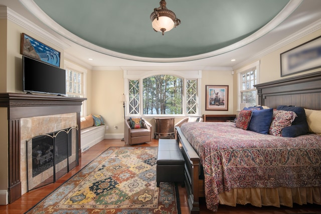 8 Spruce Point Rd, Kittery, ME 03904 - bedroom with a tray ceiling, crown molding, a fireplace with flush hearth, baseboards, and wood finished floors