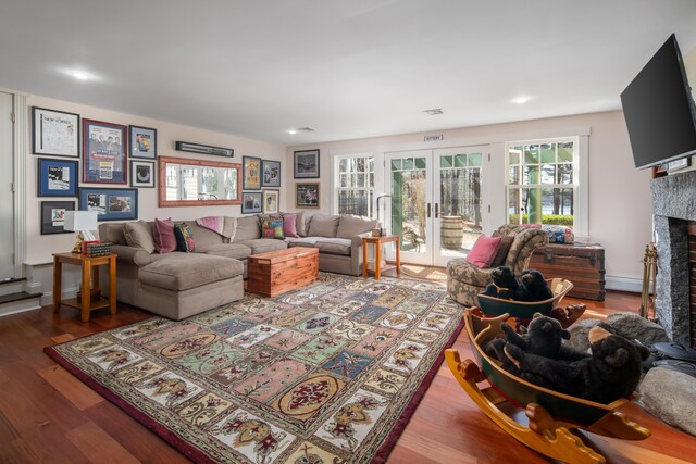 8 Spruce Point Rd, Kittery, ME 03904 - living area featuring a healthy amount of sunlight, a fireplace, and wood finished floors