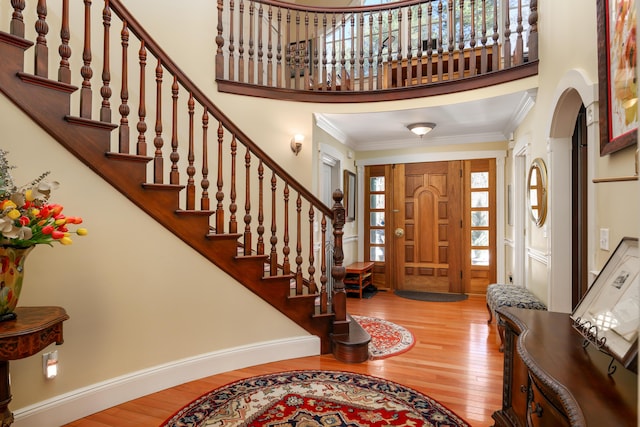 8 Spruce Point Rd, Kittery, ME 03904 - foyer with crown molding, stairs, wood-type flooring, baseboards, and a towering ceiling
