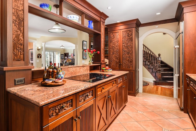 8 Spruce Point Rd, Kittery, ME 03904 - bar featuring light tile patterned flooring, stairs, black electric cooktop, arched walkways, and ornate columns