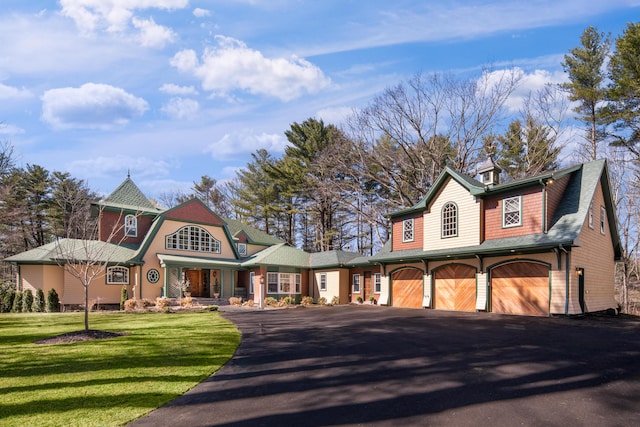 8 Spruce Point Rd, Kittery, ME 03904 - view of front of property with an attached garage, aphalt driveway, and a front yard