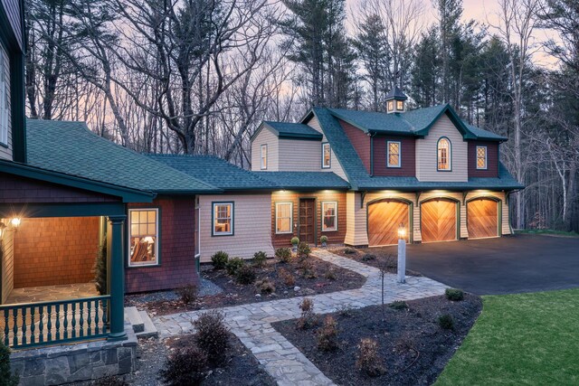 8 Spruce Point Rd, Kittery, ME 03904 - view of front of house featuring aphalt driveway, a garage, and roof with shingles