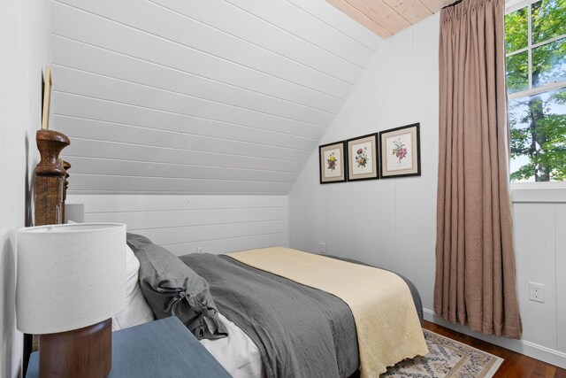 bedroom featuring wood ceiling, vaulted ceiling, and dark wood-style flooring