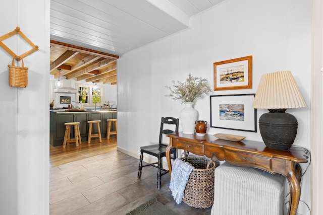 office with baseboards, wooden ceiling, and beamed ceiling