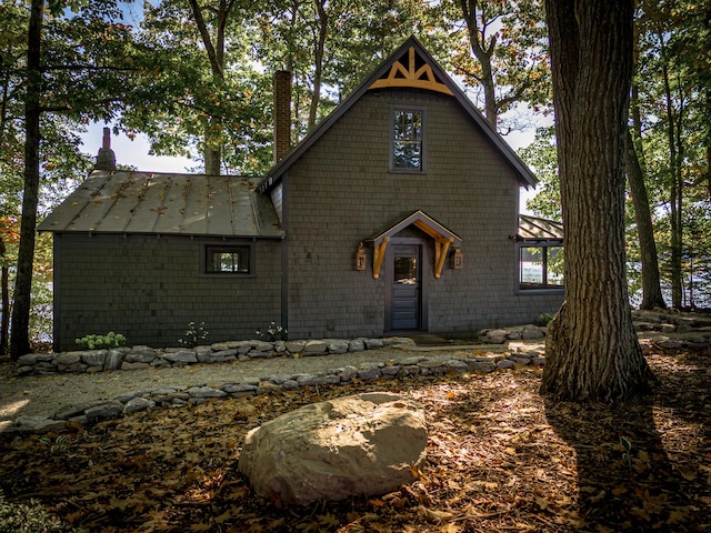 chalet / cabin featuring a chimney