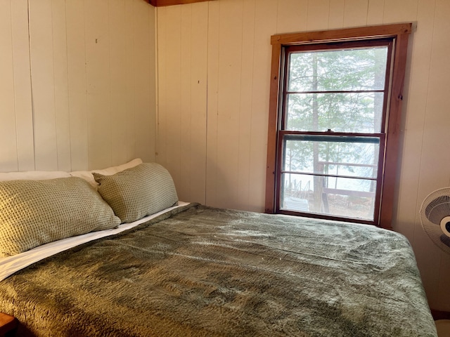 bedroom with wooden walls