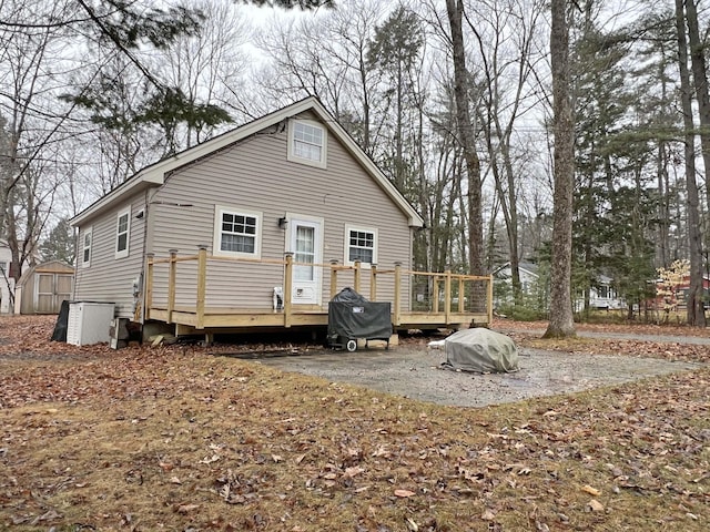 25 Garland Rd, Casco, ME 04015 - back of house featuring a shed, a wooden deck, and an outdoor structure